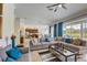 Open-concept living area with a large sectional sofa and seamless flow to the kitchen at 7388 Gathering Ct, Reunion, FL 34747