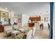 Open-concept living space with kitchen, seating area, and dining space, perfect for entertaining guests and enjoying Gathering time at 7388 Gathering Ct, Reunion, FL 34747