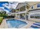 Expansive outdoor space with a private pool, spa, and covered patio at 7388 Gathering Ct, Reunion, FL 34747