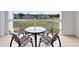 Balcony view showcasing a golf course setting, perfect for outdoor dining and relaxation at 7649 Heritage Crossing Way # 302, Reunion, FL 34747