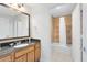 Well-lit bathroom showcasing granite countertops, a modern sink, and a pristine tiled shower/tub combination at 7649 Heritage Crossing Way # 302, Reunion, FL 34747
