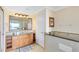 Bathroom with granite countertop and tiled backsplash at 7649 Heritage Crossing Way # 302, Reunion, FL 34747