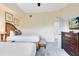 Comfortable bedroom featuring two beds, stylish furnishings, and a serene atmosphere at 7649 Heritage Crossing Way # 302, Reunion, FL 34747