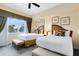 Inviting bedroom featuring two beds, plush bedding, and natural light, creating a comfortable retreat at 7649 Heritage Crossing Way # 302, Reunion, FL 34747