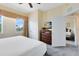 Comfortable bedroom featuring natural light, neutral colors, and ample closet space at 7649 Heritage Crossing Way # 302, Reunion, FL 34747