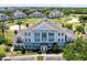 Stunning exterior view of a well-maintained multi-story residential building, reflecting sophisticated design and landscaping at 7649 Heritage Crossing Way # 302, Reunion, FL 34747