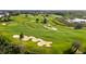 Expansive golf course with manicured greens, sand traps, and scenic views for the avid golfer at 7649 Heritage Crossing Way # 302, Reunion, FL 34747