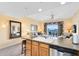 Bright kitchen with granite countertops, stainless steel appliances, and seamless access to a charming outdoor balcony at 7649 Heritage Crossing Way # 302, Reunion, FL 34747