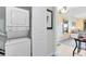 Efficient stacked washer and dryer, offering convenient laundry solutions with additional interior design elements at 7649 Heritage Crossing Way # 302, Reunion, FL 34747