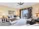 Inviting living room boasts a walkout to a private balcony and comfortable sectional sofa with stylish decor at 7649 Heritage Crossing Way # 302, Reunion, FL 34747