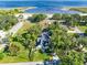Aerial view of the home and surroundings with a beach nearby at 910 Cypress Ave, St Cloud, FL 34769