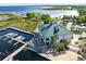 Aerial view of waterfront property and dock at 910 Cypress Ave, St Cloud, FL 34769