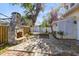 The backyard features a stone fireplace, stone patio and an arbor at 910 Cypress Ave, St Cloud, FL 34769