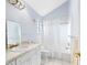 Clean bathroom with tub-shower combination and single vanity at 910 Cypress Ave, St Cloud, FL 34769