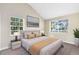 Bedroom featuring carpet floors, vaulted ceilings, and large windows for natural light at 910 Cypress Ave, St Cloud, FL 34769