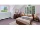 Charming bedroom with stylish furniture, large windows, and cozy decor for a relaxing retreat at 910 Cypress Ave, St Cloud, FL 34769