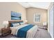 Bedroom with plush rug, accent wall, vaulted ceiling, and natural light at 910 Cypress Ave, St Cloud, FL 34769