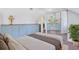 This bedroom features blue built-in cabinetry and mirrored closet doors at 910 Cypress Ave, St Cloud, FL 34769