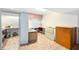 Spacious bonus room area with a variety of storage and workspace at 910 Cypress Ave, St Cloud, FL 34769