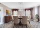 Formal dining room featuring a chandelier, elegant decor, and ample seating at 910 Cypress Ave, St Cloud, FL 34769