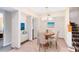 Inviting dining area featuring a round table, cushioned chairs, and elegant chandelier at 910 Cypress Ave, St Cloud, FL 34769