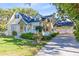 Charming yellow home with well-maintained landscaping and a three-car garage at 910 Cypress Ave, St Cloud, FL 34769