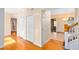 Foyer featuring wood floors, coat closet, and stairway at 910 Cypress Ave, St Cloud, FL 34769