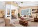Bright and airy living room featuring a piano, comfortable seating, and neutral tones at 910 Cypress Ave, St Cloud, FL 34769