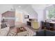 Cozy living area featuring comfortable seating, a desk and an open door to the outside at 910 Cypress Ave, St Cloud, FL 34769