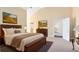 Spacious main bedroom with ensuite bath and vaulted ceiling at 910 Cypress Ave, St Cloud, FL 34769