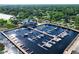 Boats docked at a marina, with a clubhouse and green landscapes nearby at 910 Cypress Ave, St Cloud, FL 34769