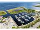 An aerial view of a community marina with boat slips and access to a large body of water at 910 Cypress Ave, St Cloud, FL 34769