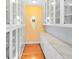 Walk-in pantry featuring custom shelving, cabinets, and a unique window at 910 Cypress Ave, St Cloud, FL 34769
