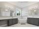 Bright bathroom with freestanding tub, shower, and double vanity at 922 Home Grove Dr, Winter Garden, FL 34787