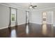 Spacious bedroom featuring hardwood floors and an entryway leading to the bathroom at 922 Home Grove Dr, Winter Garden, FL 34787