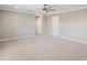 Carpeted bonus room featuring neutral walls, a ceiling fan, and a doorway to another room at 922 Home Grove Dr, Winter Garden, FL 34787