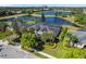 Beautifully landscaped two-story home with a screened-in pool overlooking a tranquil lake at 922 Home Grove Dr, Winter Garden, FL 34787