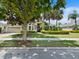 Charming home with a well-manicured lawn, mature trees, and a two-car garage, showcasing its curb appeal at 922 Home Grove Dr, Winter Garden, FL 34787