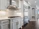 Gourmet kitchen with stainless steel appliances and marble backsplash at 922 Home Grove Dr, Winter Garden, FL 34787