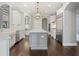 Gourmet kitchen featuring white cabinets, stainless steel appliances, and a center island with seating at 922 Home Grove Dr, Winter Garden, FL 34787