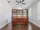 Office with hardwood floors, large built in bookcase, and big desk at 922 Home Grove Dr, Winter Garden, FL 34787