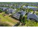 Aerial view featuring a screened-in pool with a fenced yard and neighboring community pond at 922 Home Grove Dr, Winter Garden, FL 34787