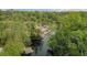 Aerial view showcasing the waterfront area with kayak launches and lush trees, ideal for outdoor adventures at 934 Deerwood Loop, Longwood, FL 32779