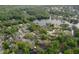 This aerial shows the home's location relative to a nearby lake and other homes at 934 Deerwood Loop, Longwood, FL 32779