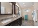 Bathroom featuring a double vanity, a window and a tiled floor at 934 Deerwood Loop, Longwood, FL 32779