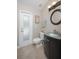 Bathroom featuring a modern vanity, frosted door to the lanai, and sleek fixtures at 934 Deerwood Loop, Longwood, FL 32779