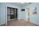 Bedroom features closet with custom shelving, light blue walls, and an en-suite bathroom at 934 Deerwood Loop, Longwood, FL 32779