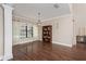 Elegant dining room with dark wood floors, chandelier, and view to the outdoor area at 934 Deerwood Loop, Longwood, FL 32779