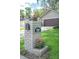 Charming curb appeal is highlighted by a decorative brick mailbox and a well-maintained lawn and landscaping at 934 Deerwood Loop, Longwood, FL 32779