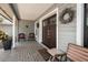 Inviting front porch with double doors, decorative wreath, and seating area at 934 Deerwood Loop, Longwood, FL 32779